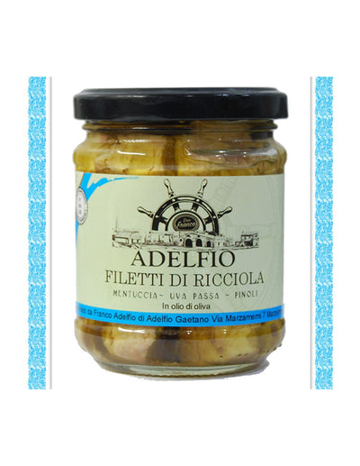 Filets de sériole à la mentuccia, raisins secs et pignons de pin à l'huile d'olive - Adelfio